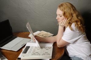 Young lady researching genealogy
